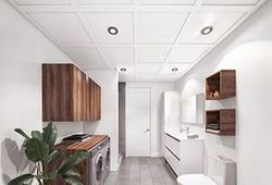 A laundry room with Embassy Ceiling's suspended ceiling system.