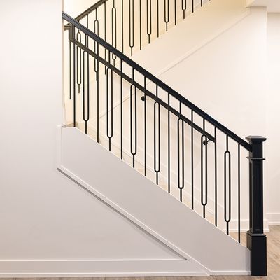 Eclectic style staircase wood and wrought iron, with baseboard