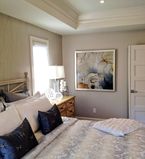 Beige bedroom with matching casing on the ceiling