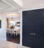 White entrance way with white moulding around entrances and doors with white baseboards