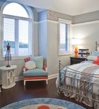 Pale blue bedroom with window casings and basboards