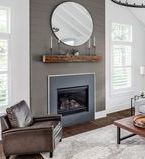 Feature sage painted shiplap wall with built in fireplace in living room