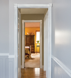 Matching white casing along both door ways on a hallway