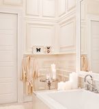 Bathroom with all white moulding, casing and paneling