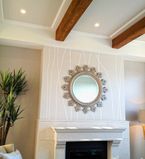 Fireplace on the wall with white moulding